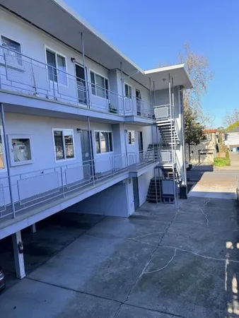 a view of a car park in front of house