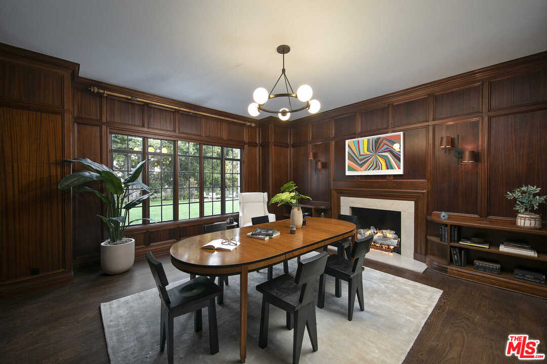 910 North Rexford Drive Beverly Hills, CA 90210 - Photo 11 of 32 a dining room with furniture a chandelier and window