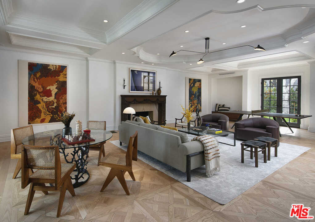 910 North Rexford Drive Beverly Hills, CA 90210 - Photo 8 of 32 a living room with furniture and a fireplace