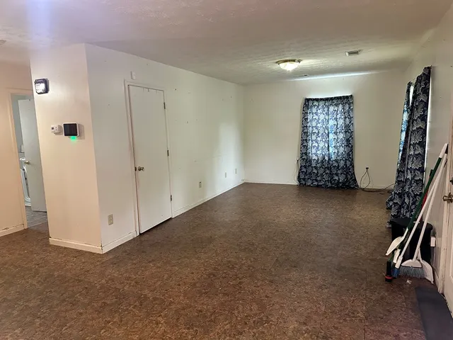 a view of room with stairs and a window