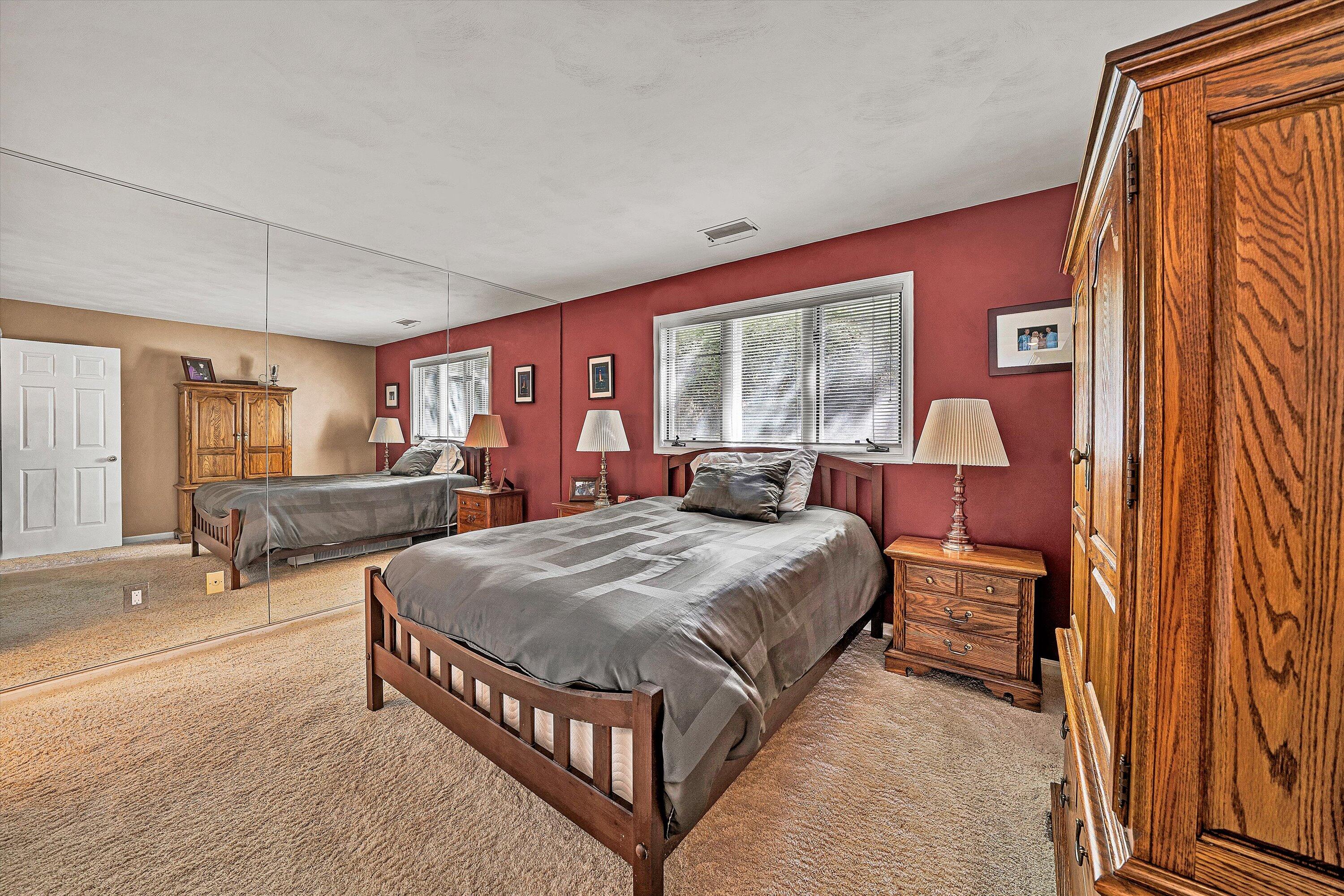 410 Marina Bay Drive, Unit 102 Penhook, VA 24137 - Photo 20 of 38 a spacious bedroom with a bed and window