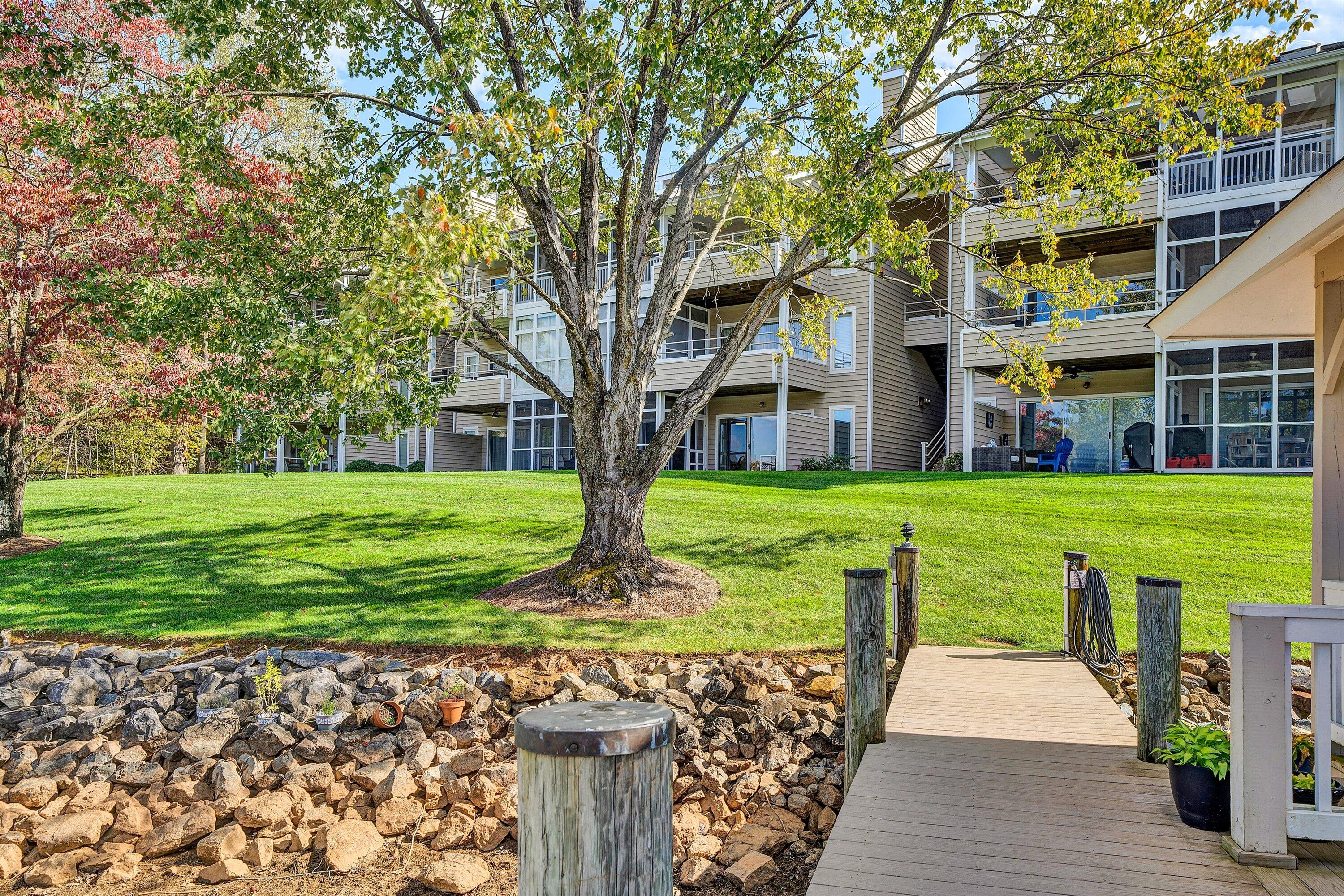 410 Marina Bay Drive, Unit 102 Penhook, VA 24137 - Photo 2 of 38 a view of a house with garden