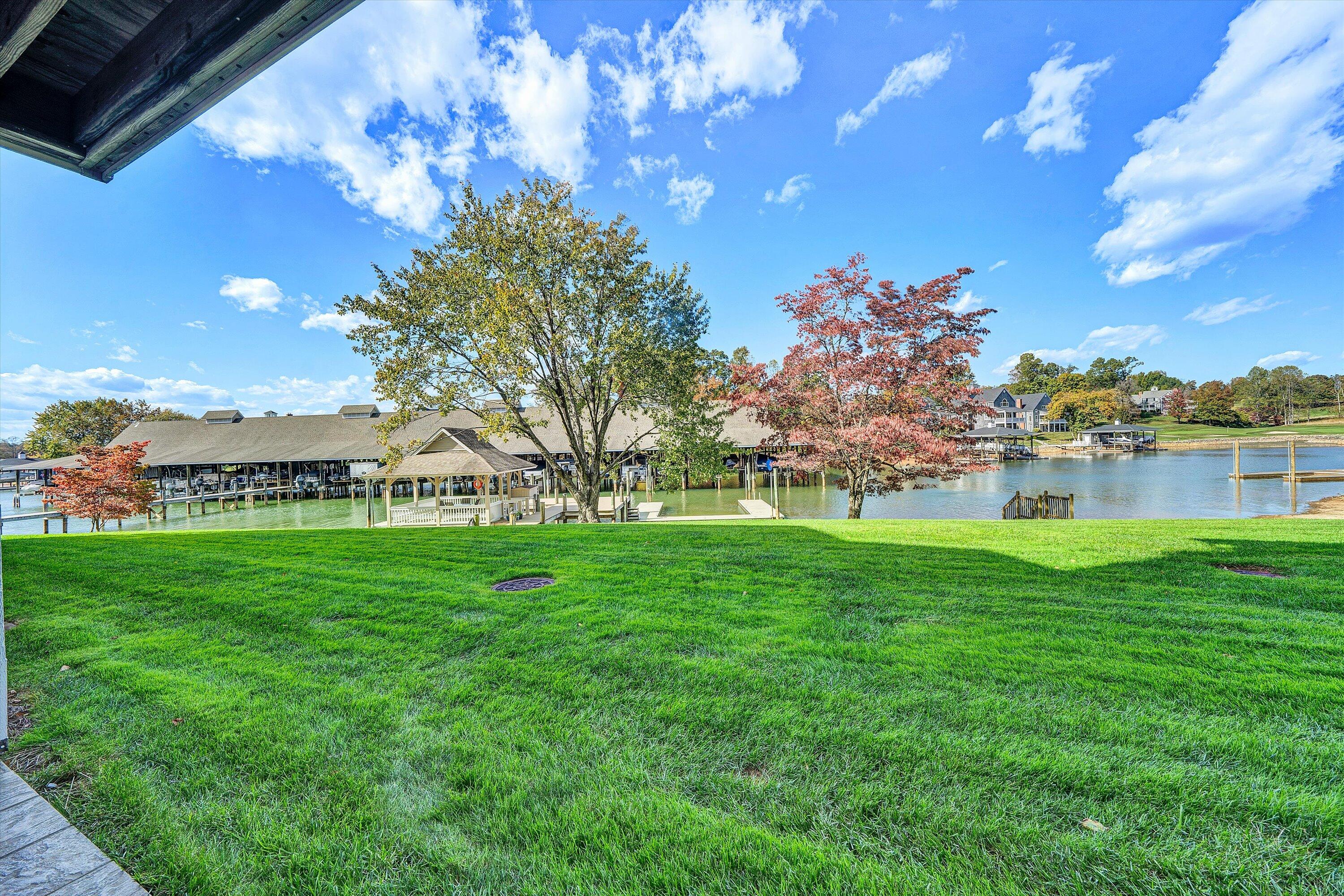 410 Marina Bay Drive, Unit 102 Penhook, VA 24137 - Photo 24 of 38 a view of a garden with houses