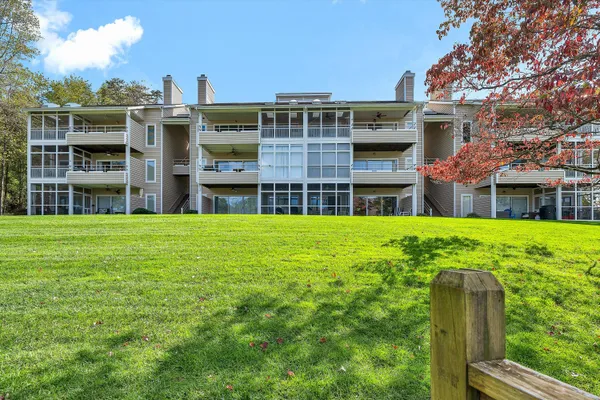 a view of a brick building with many windows