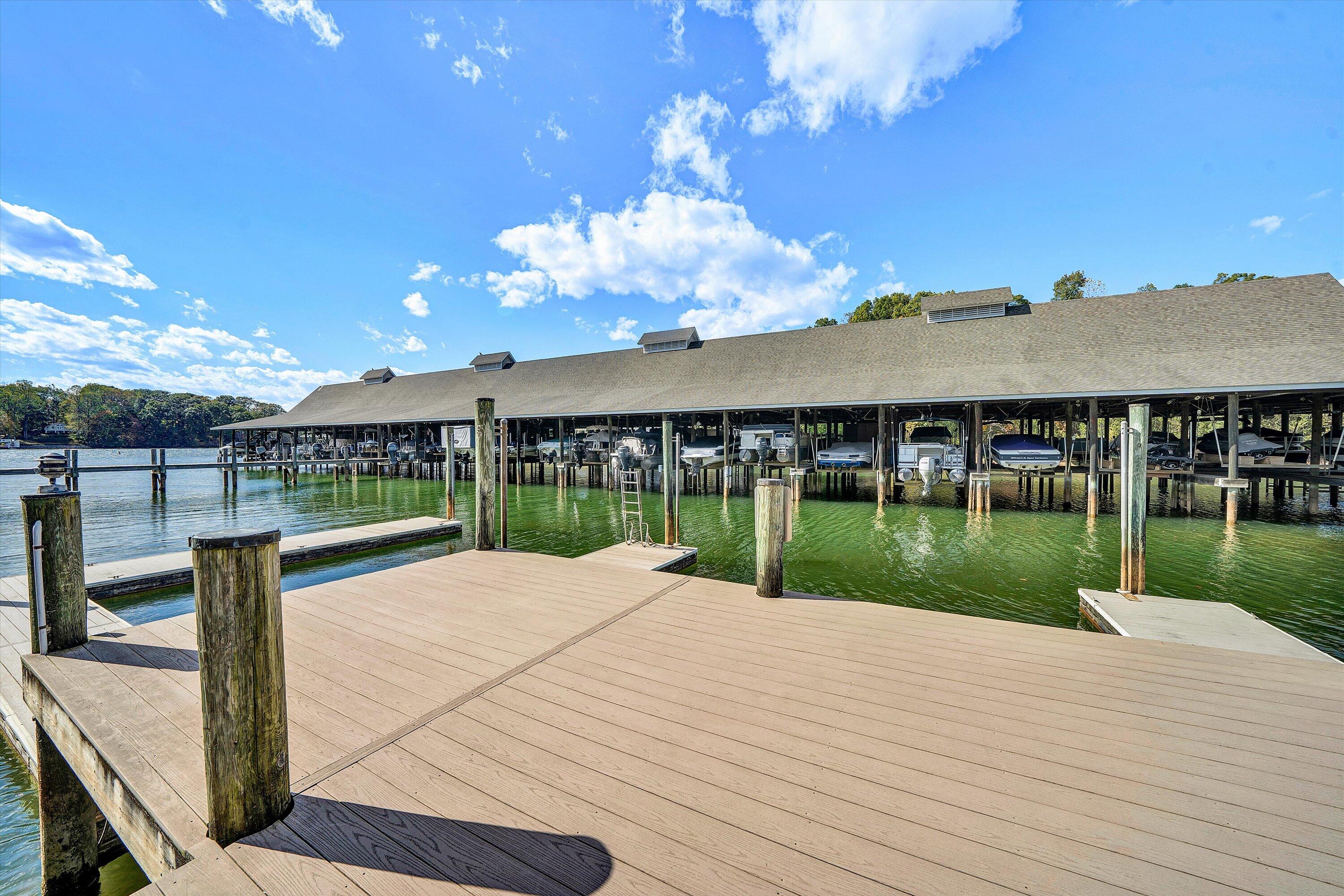 410 Marina Bay Drive, Unit 102 Penhook, VA 24137 - Photo 30 of 38 a view of a house with a yard