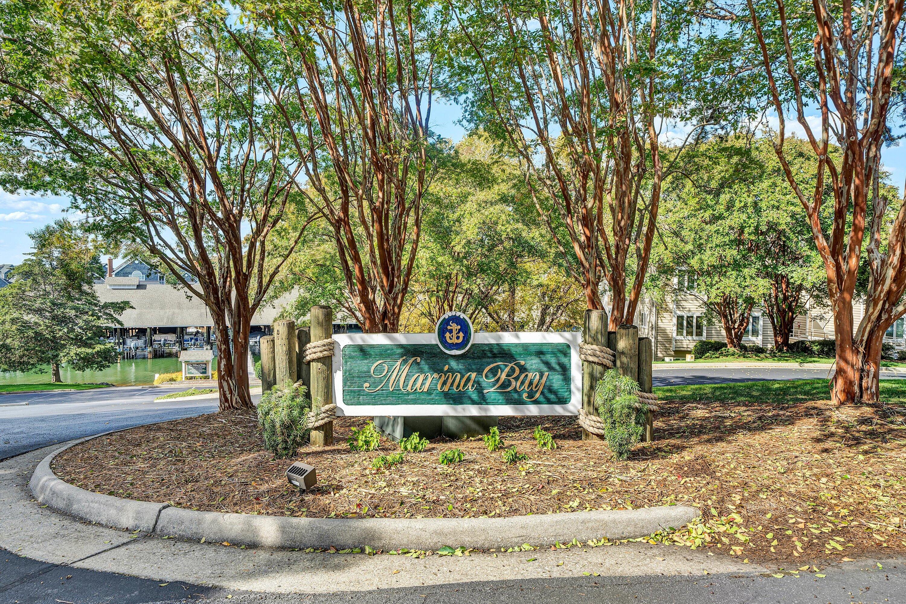 410 Marina Bay Drive, Unit 102 Penhook, VA 24137 - Photo 33 of 38 a sign board with tree in the back