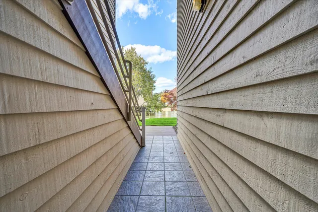 a balcony with stairs and a floor to ceiling window