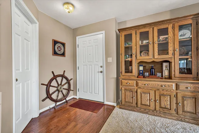 a living room with furniture a large window and a flat screen tv