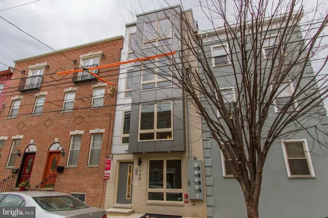 a front view of a building with multiple windows