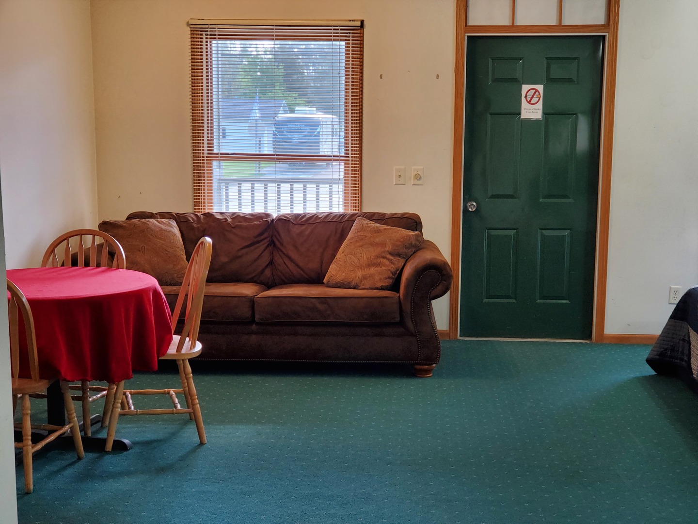325 South Clark Street, Unit 1F Utica, IL 61373 - Photo 3 of 9 a living room with furniture and a window