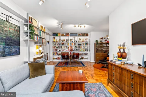 a living room with lots of furniture and a flat screen tv