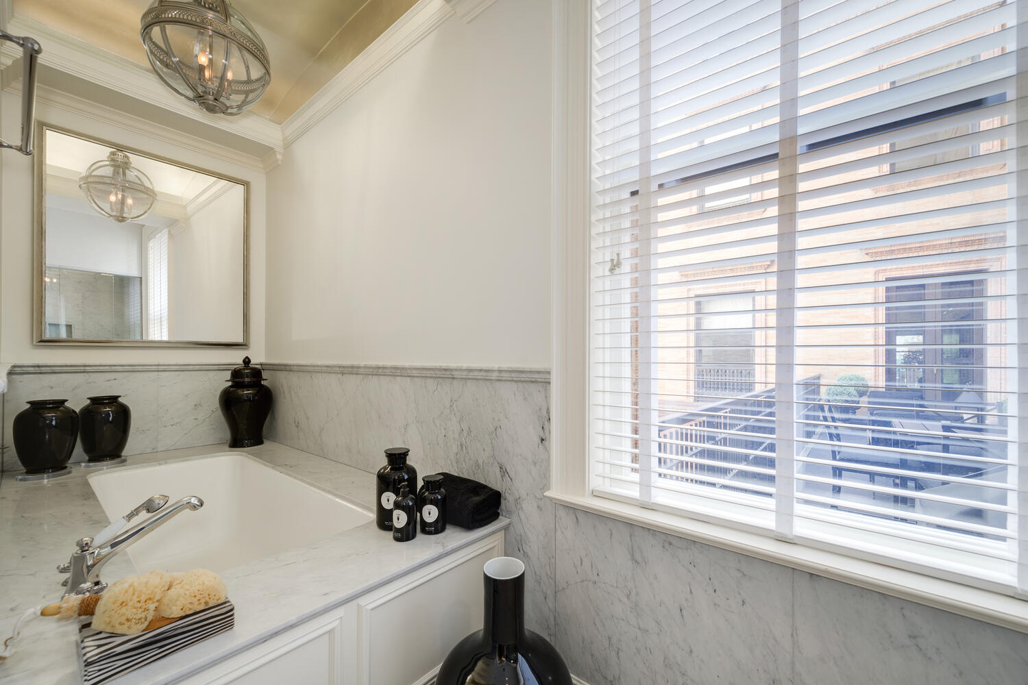 1500 North Astor Street, Unit 6 Chicago, IL 60610 - Photo 28 of 39 a bathroom with a sink and a window