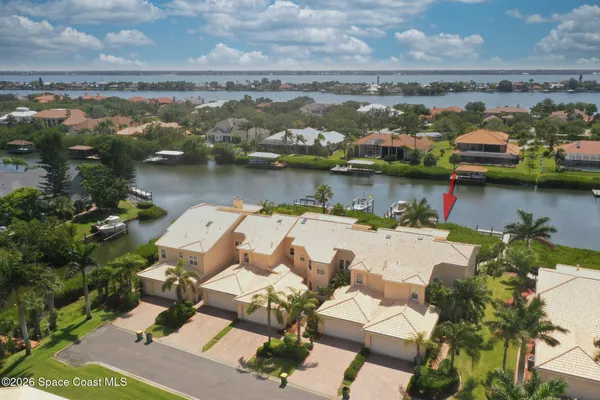 an aerial view of a house with a lake view