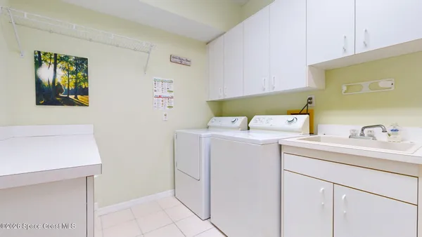 a bathroom with a tub a sink double vanity and mirror