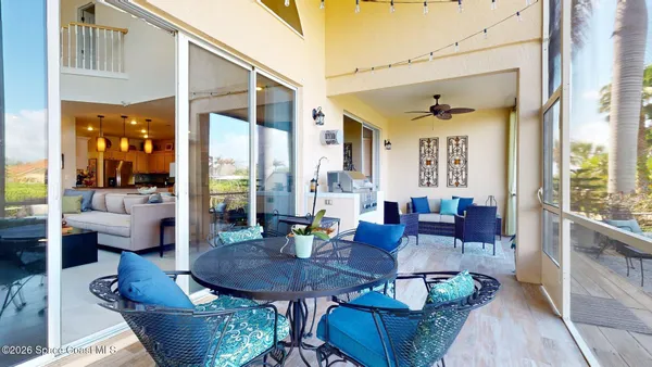a view of a chairs and table in patio