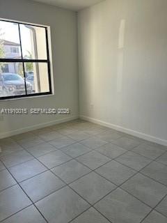 11781 Southwest 245 Terrace, Unit 11781 Homestead, FL 33032 - Photo 10 of 14 an empty room with windows