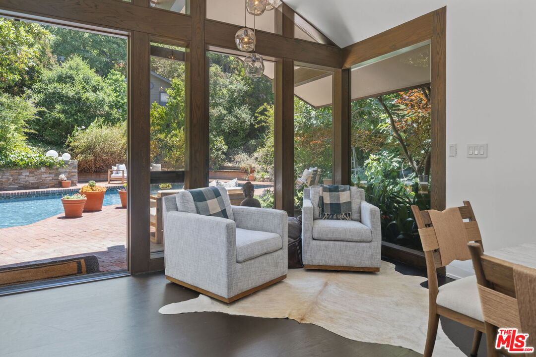 3 Latimer Road Santa Monica, CA 90402 - Photo 11 of 35 a living room with furniture and a large window