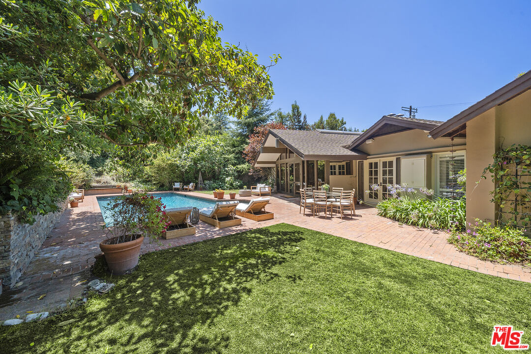 3 Latimer Road Santa Monica, CA 90402 - Photo 2 of 35 a view of a house with backyard sitting area and swimming pool