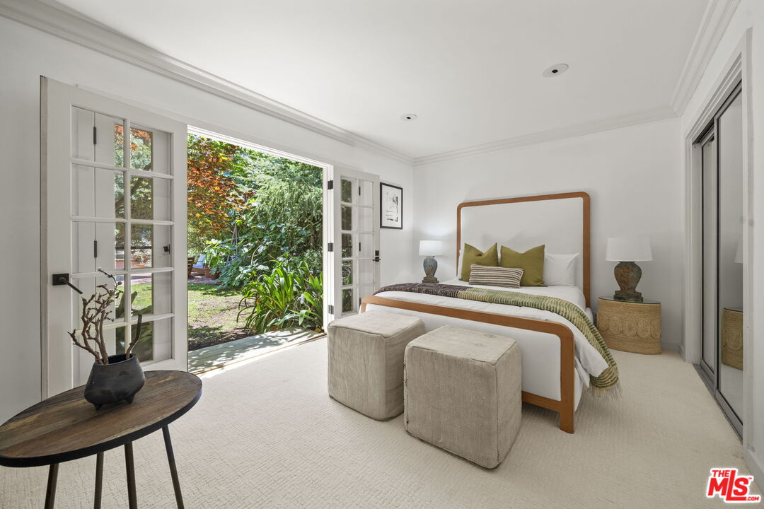 3 Latimer Road Santa Monica, CA 90402 - Photo 22 of 35 a bedroom with a bed and a window