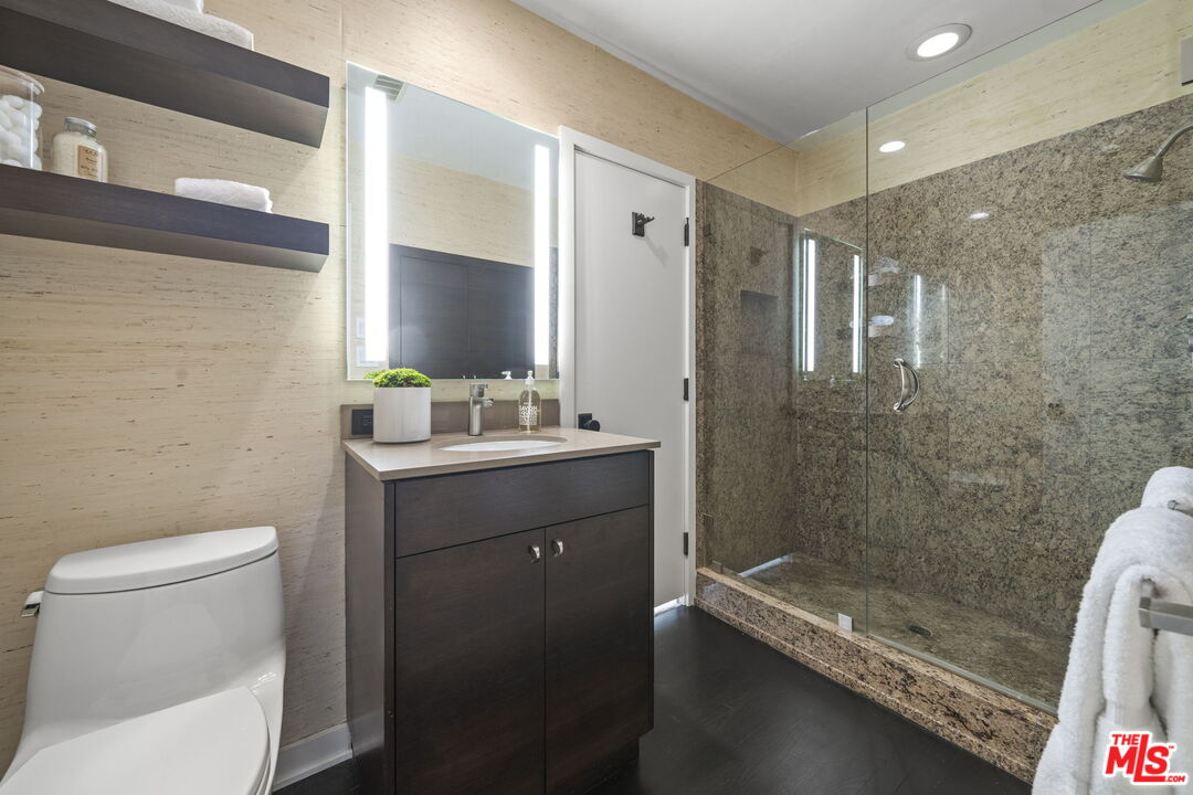 3 Latimer Road Santa Monica, CA 90402 - Photo 24 of 35 a bathroom with a sink a toilet a mirror and shower