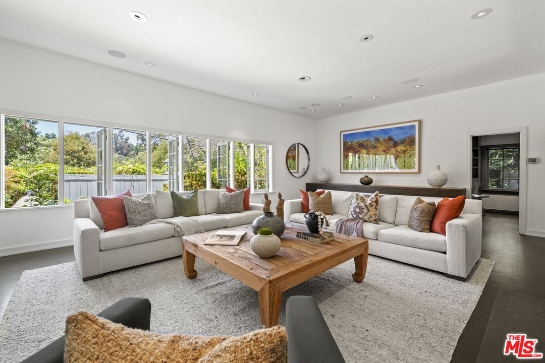 3 Latimer Road Santa Monica, CA 90402 - Photo 3 of 35 a living room with furniture and a large window