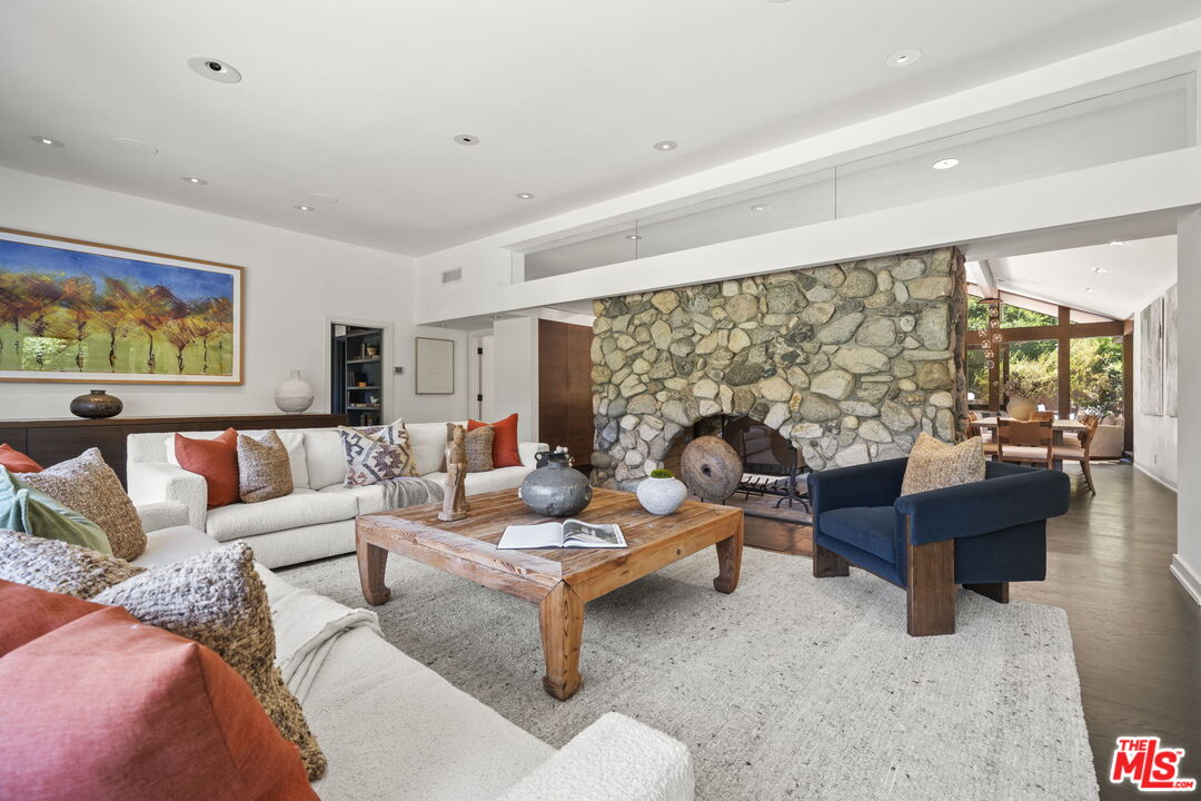 3 Latimer Road Santa Monica, CA 90402 - Photo 5 of 35 a living room with fireplace furniture and a large window