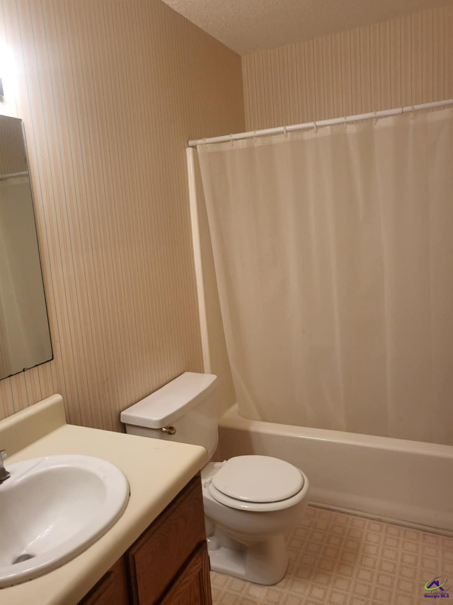 4472 Club Trace Macon, GA 31210 - Photo 9 of 10 a bathroom with a sink a toilet and a shower