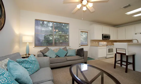a living room with furniture and a large window