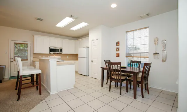 a view of a dining room with furniture