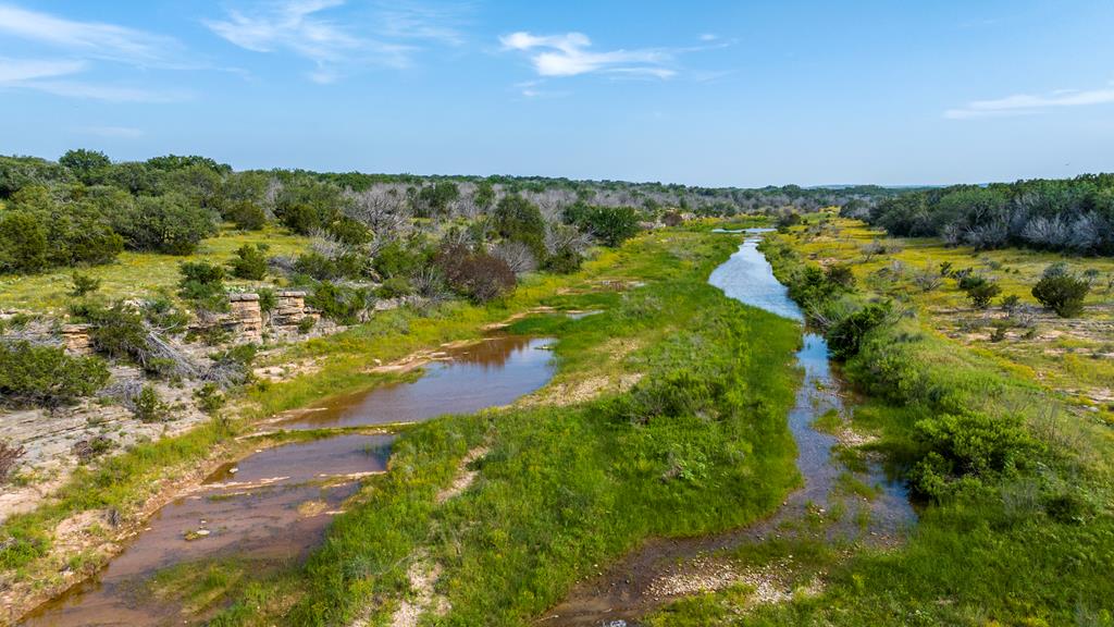 2199 Langes Mill Road Doss, TX 78618 - Photo 1 of 40 a view of a lake with houses in the back