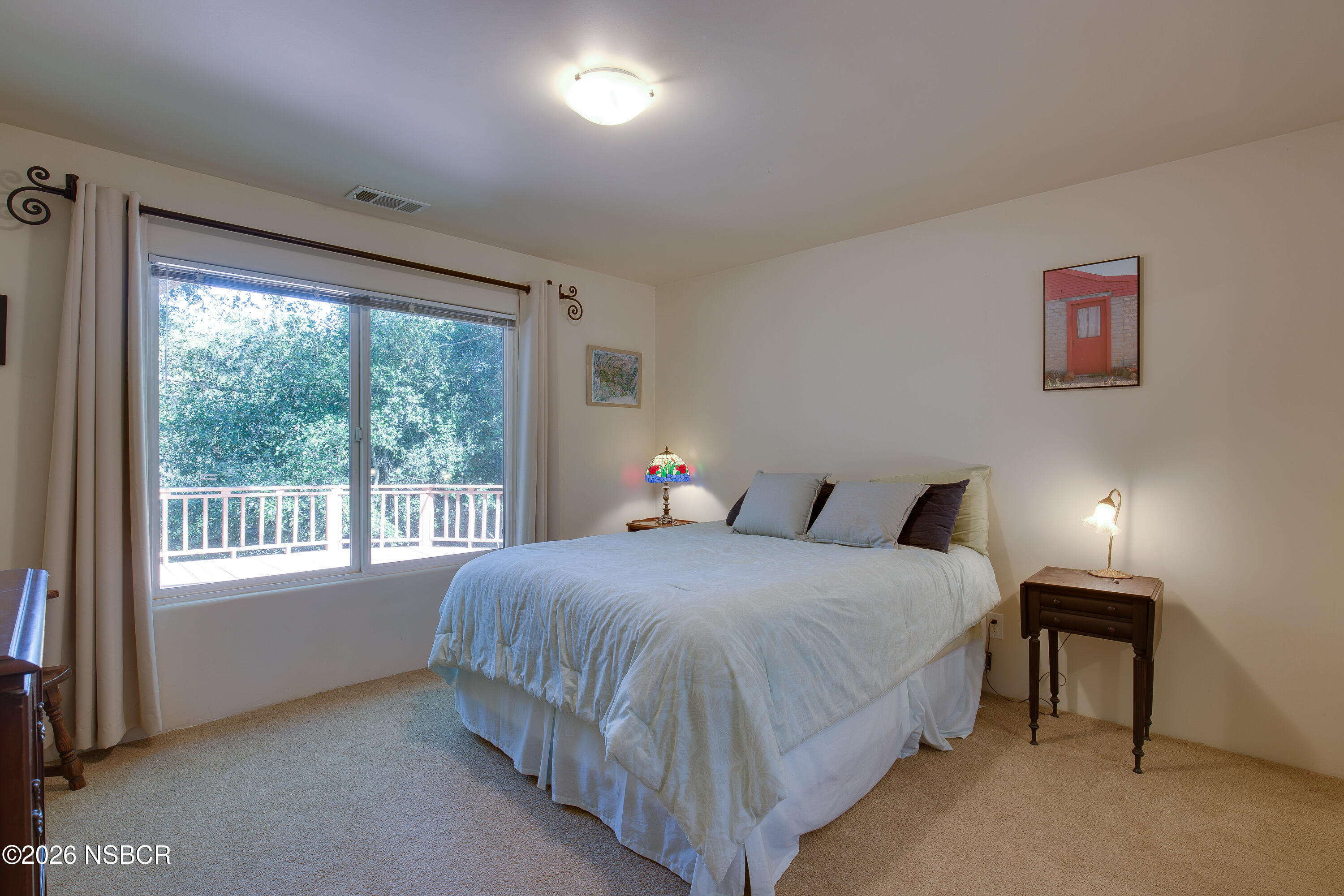 850 Fredensborg Canyon Road Solvang, CA 93463 - Photo 13 of 26 a bedroom with a bed and a window