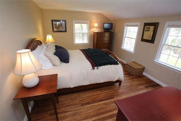 7 Sutherland Road Lexington, MA 02421 - Photo 17 of 22 a bedroom with a bed and windows