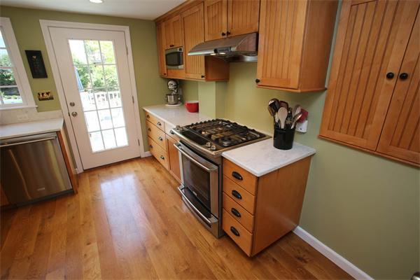 7 Sutherland Road Lexington, MA 02421 - Photo 7 of 22 a kitchen with wooden floors and a sink