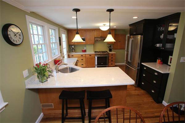 7 Sutherland Road Lexington, MA 02421 - Photo 10 of 22 a kitchen with a table and chairs in it