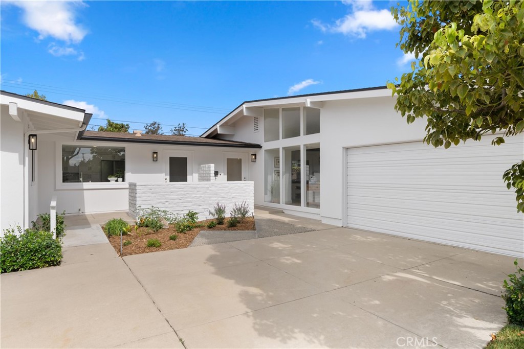 a front view of a house with a garage