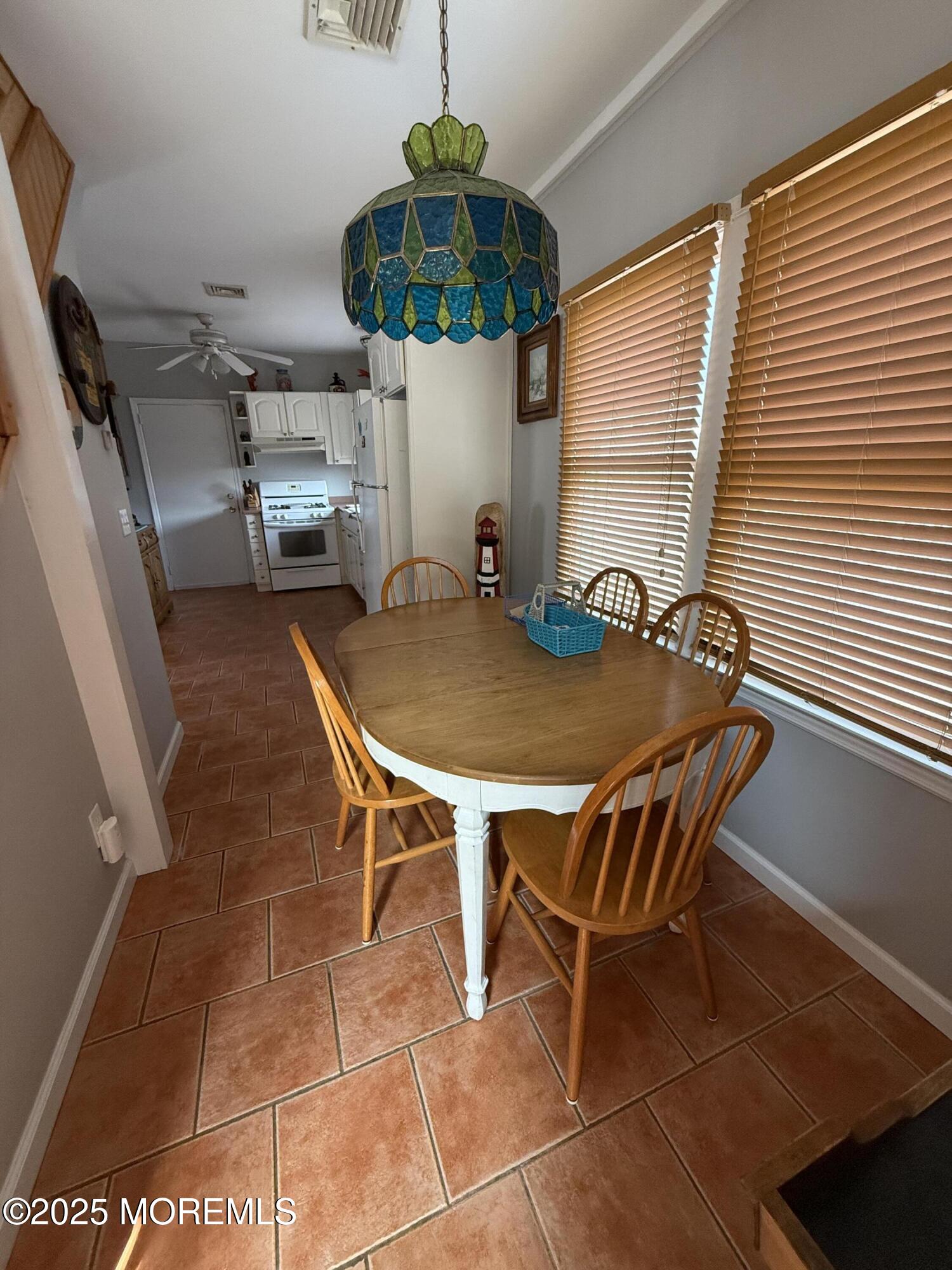 62 A Inlet Drive Point Pleasant Beach, NJ 08742 - Photo 25 of 30 a view of a dining room with furniture and chandelier