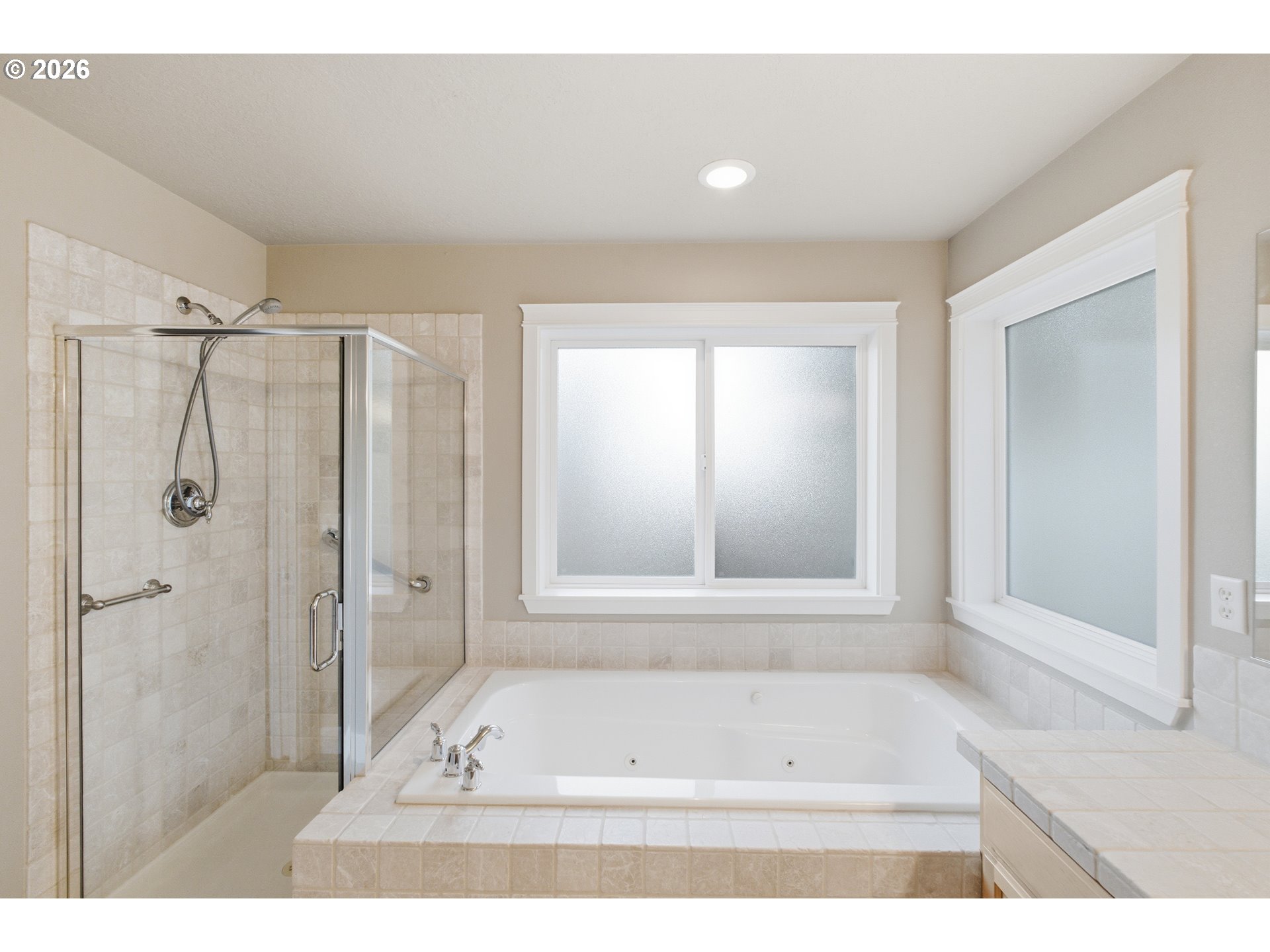 2463 Northwest Broadway Street Albany, OR 97321 - Photo 12 of 15 a bathroom with a bathtub and a shower
