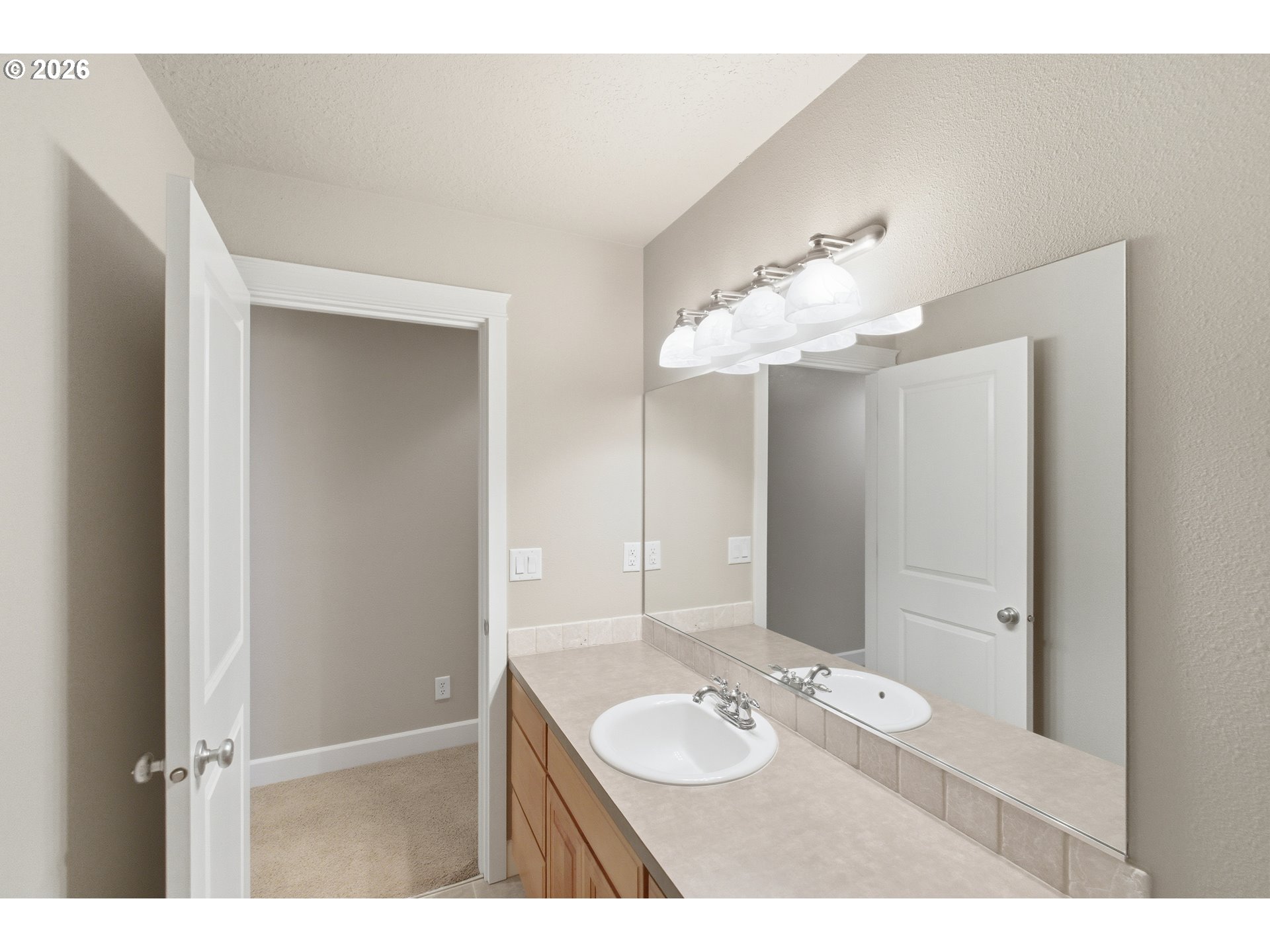 2463 Northwest Broadway Street Albany, OR 97321 - Photo 14 of 15 a bathroom with a sink vanity and a mirror