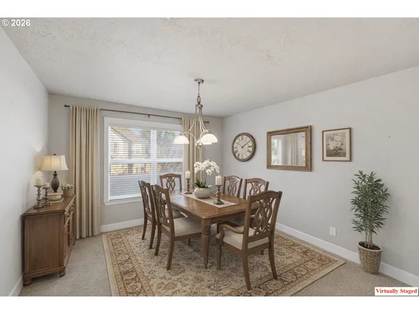 a dining room with furniture and window