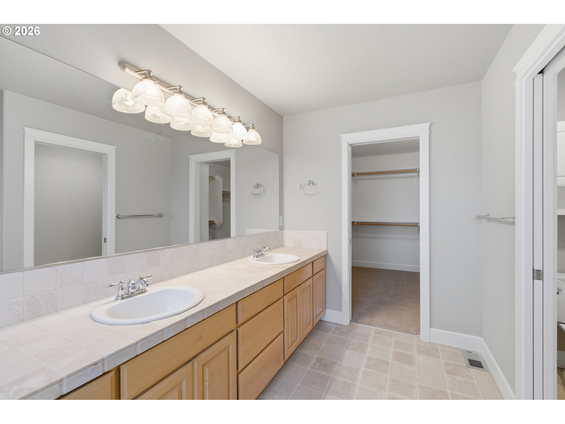 2463 Northwest Broadway Street Albany, OR 97321 - Photo 10 of 15 a bathroom with a sink a vanity and a mirror