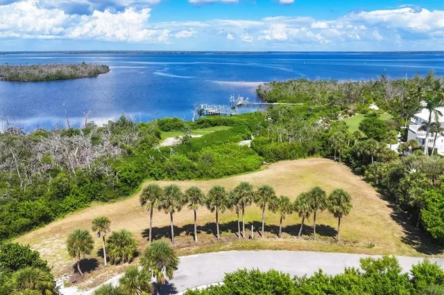 a view of lake with a yard