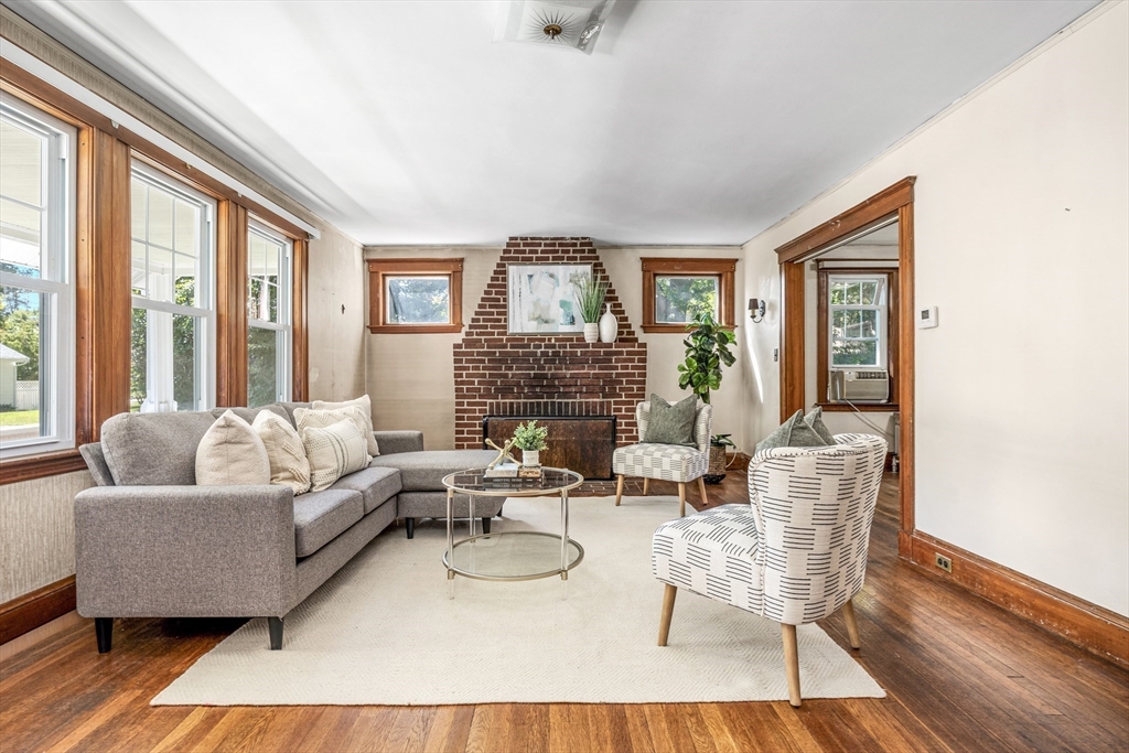 22 Linscott Road Hingham, MA 02043 - Photo 2 of 14 a living room with furniture and a fireplace