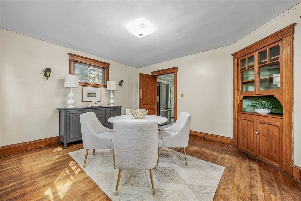 22 Linscott Road Hingham, MA 02043 - Photo 7 of 14 a dining room with furniture a rug and wooden floor
