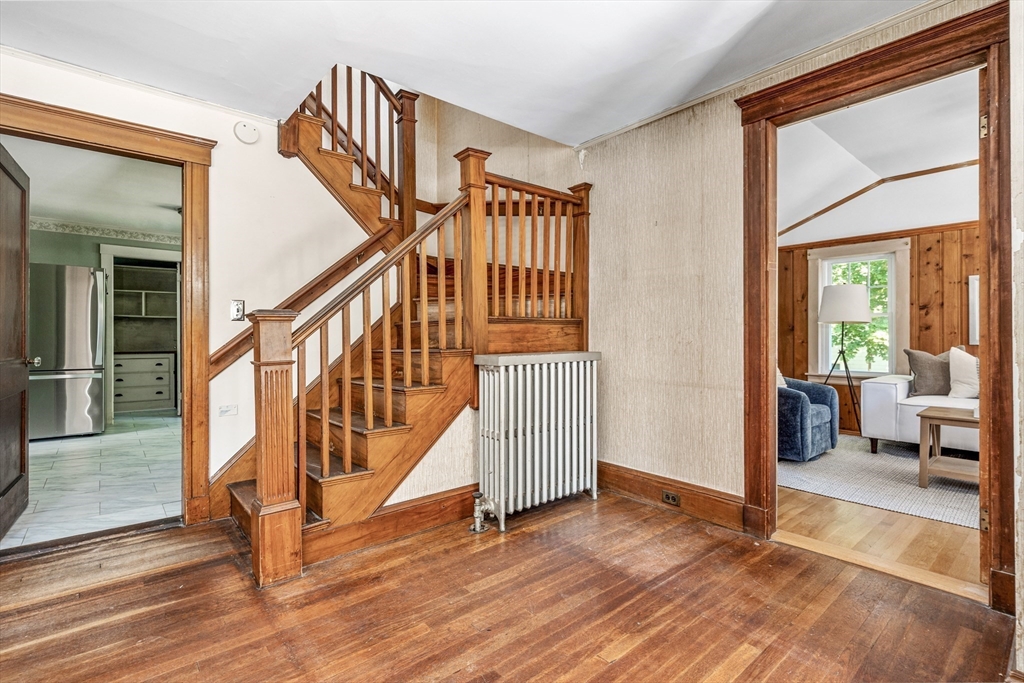 22 Linscott Road Hingham, MA 02043 - Photo 9 of 14 a view of front door with hallway and wooden floor