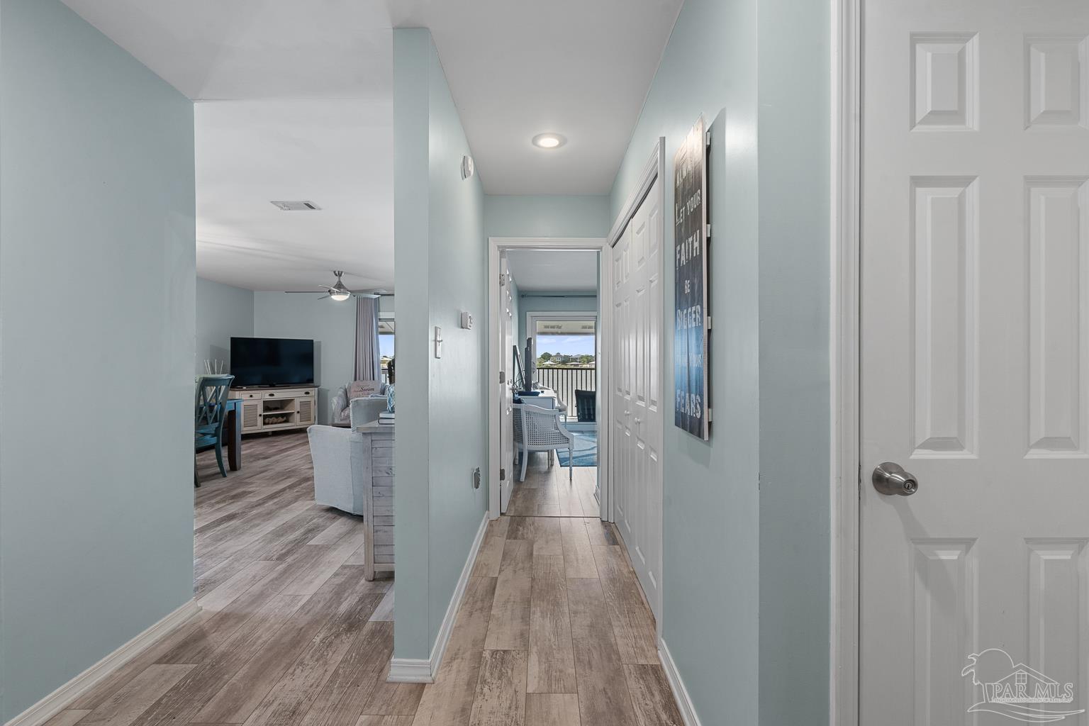 16470 Perdido Key Drive, Unit A 24 Perdido Key, FL 32507 - Photo 21 of 60 a view of a hallway view with wooden floor and living room