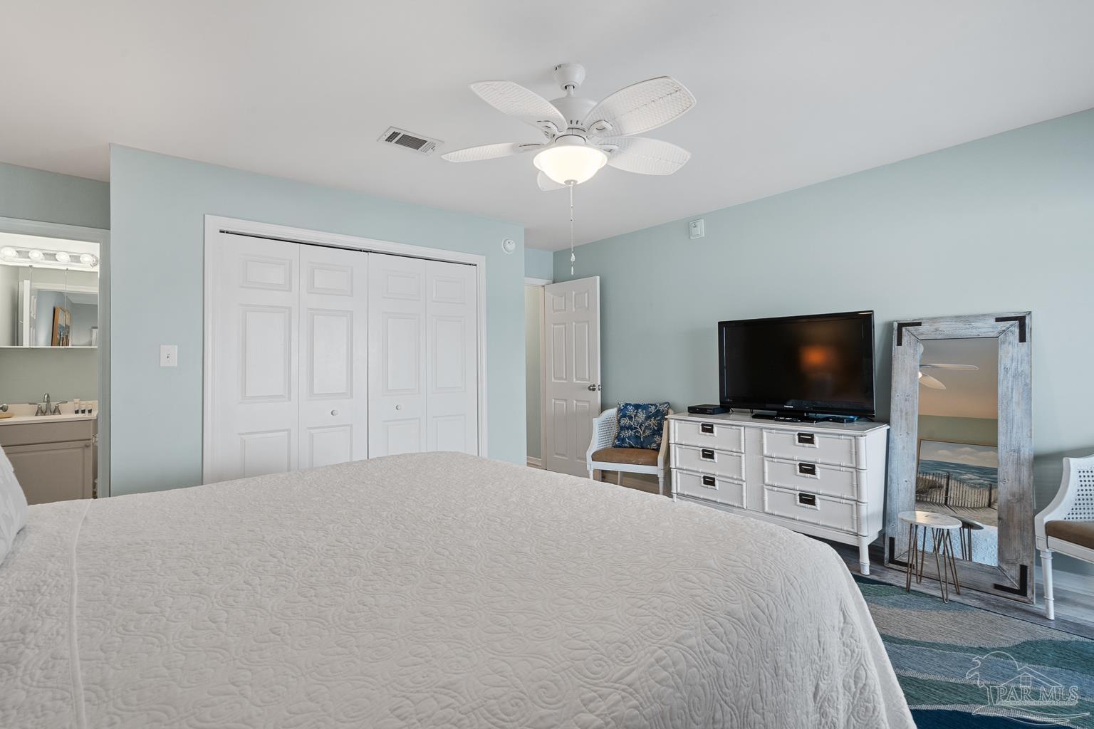 16470 Perdido Key Drive, Unit A 24 Perdido Key, FL 32507 - Photo 25 of 60 a bedroom with a bed and a flat screen tv