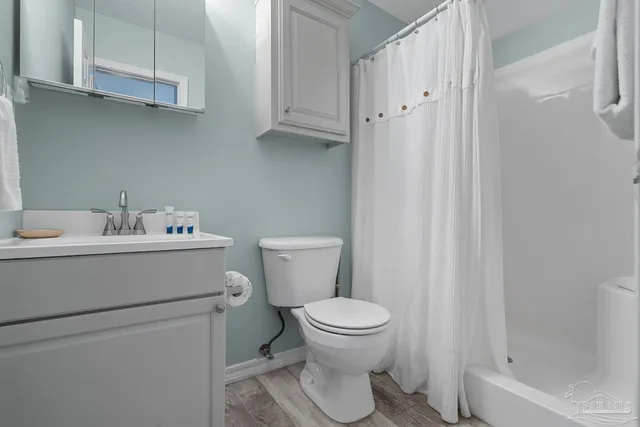 a bedroom with a bed and a night stand