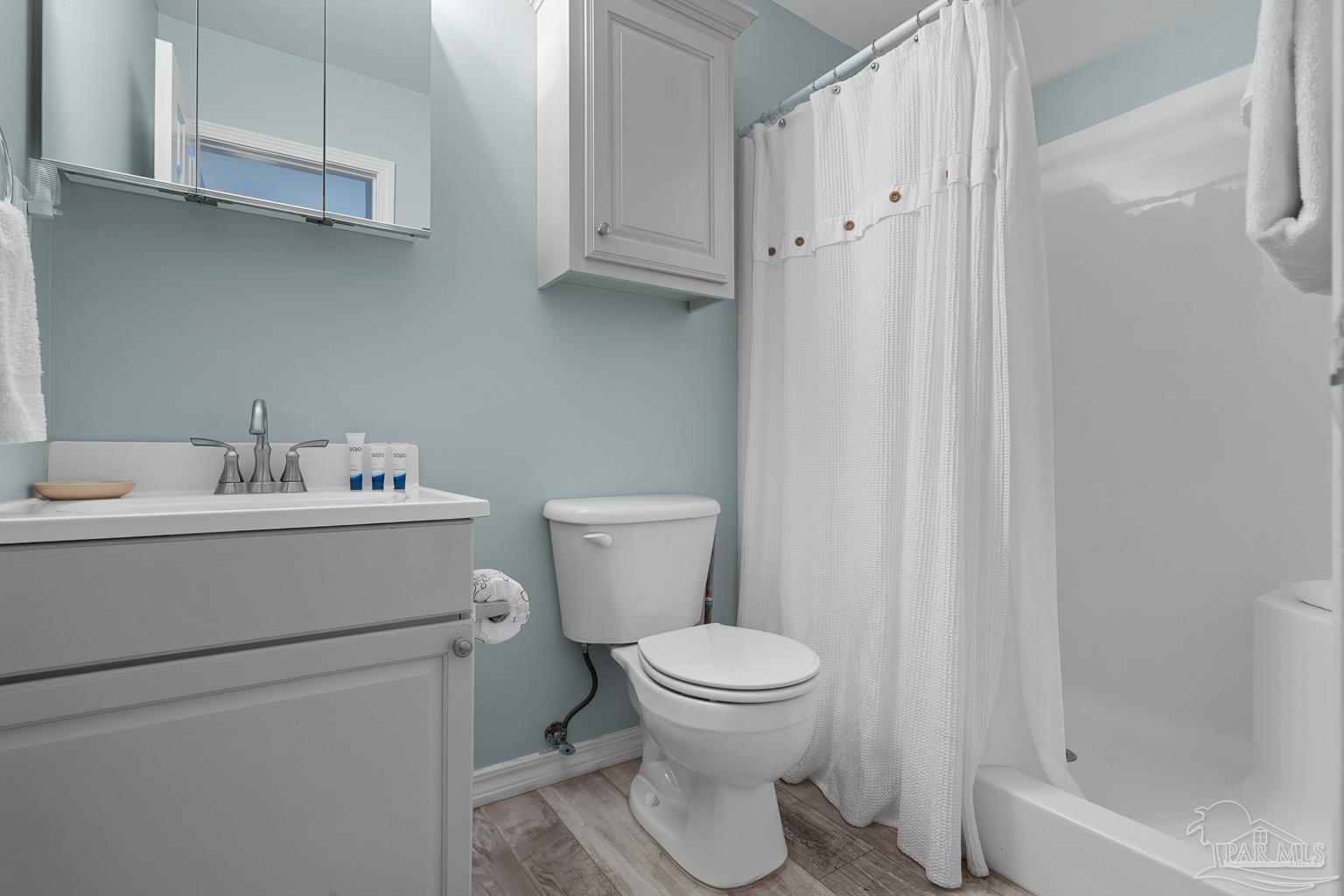 16470 Perdido Key Drive, Unit A 24 Perdido Key, FL 32507 - Photo 26 of 60 a white toilet sitting next to a bathroom sink