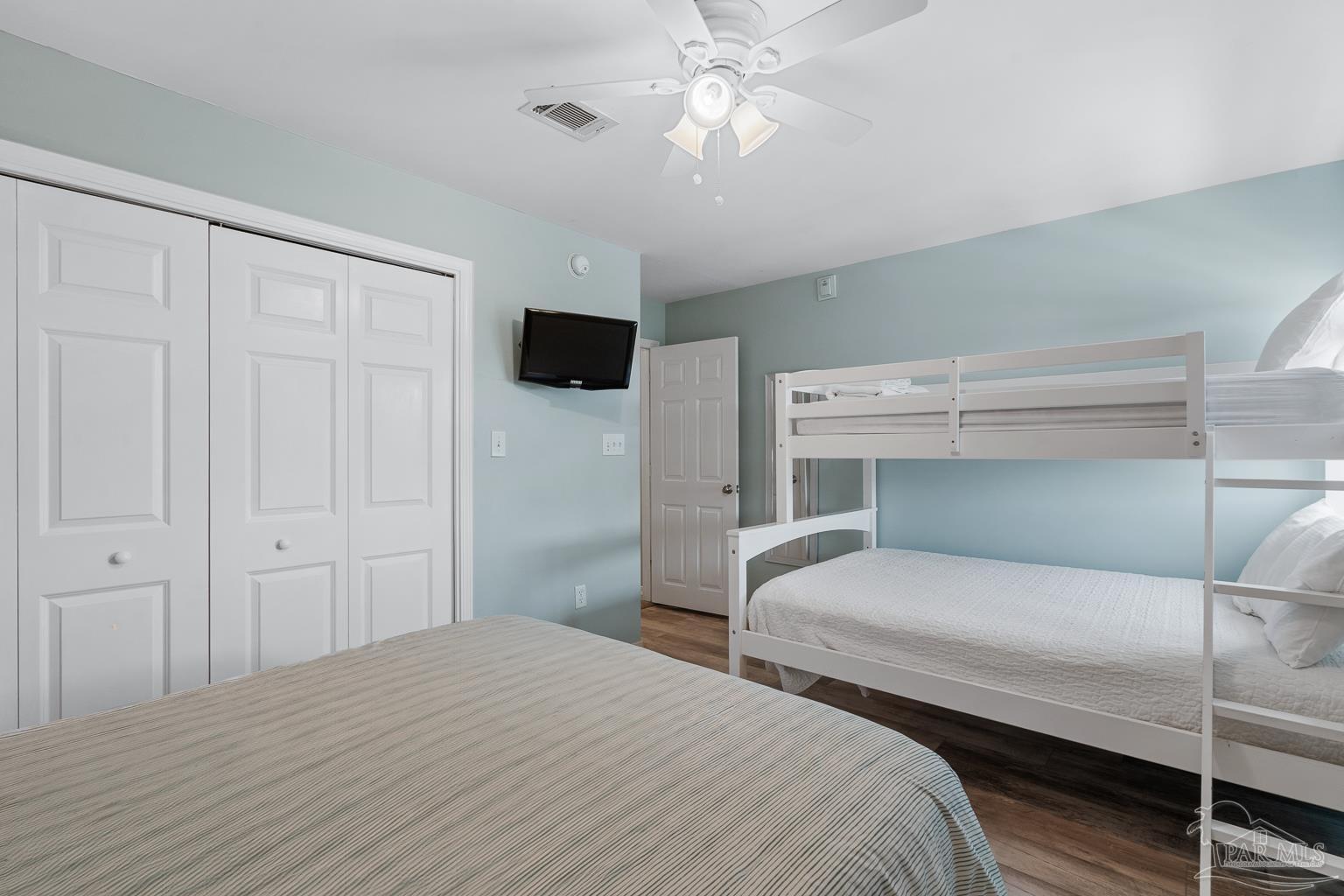 16470 Perdido Key Drive, Unit A 24 Perdido Key, FL 32507 - Photo 29 of 60 a bedroom with a bed and a chandelier