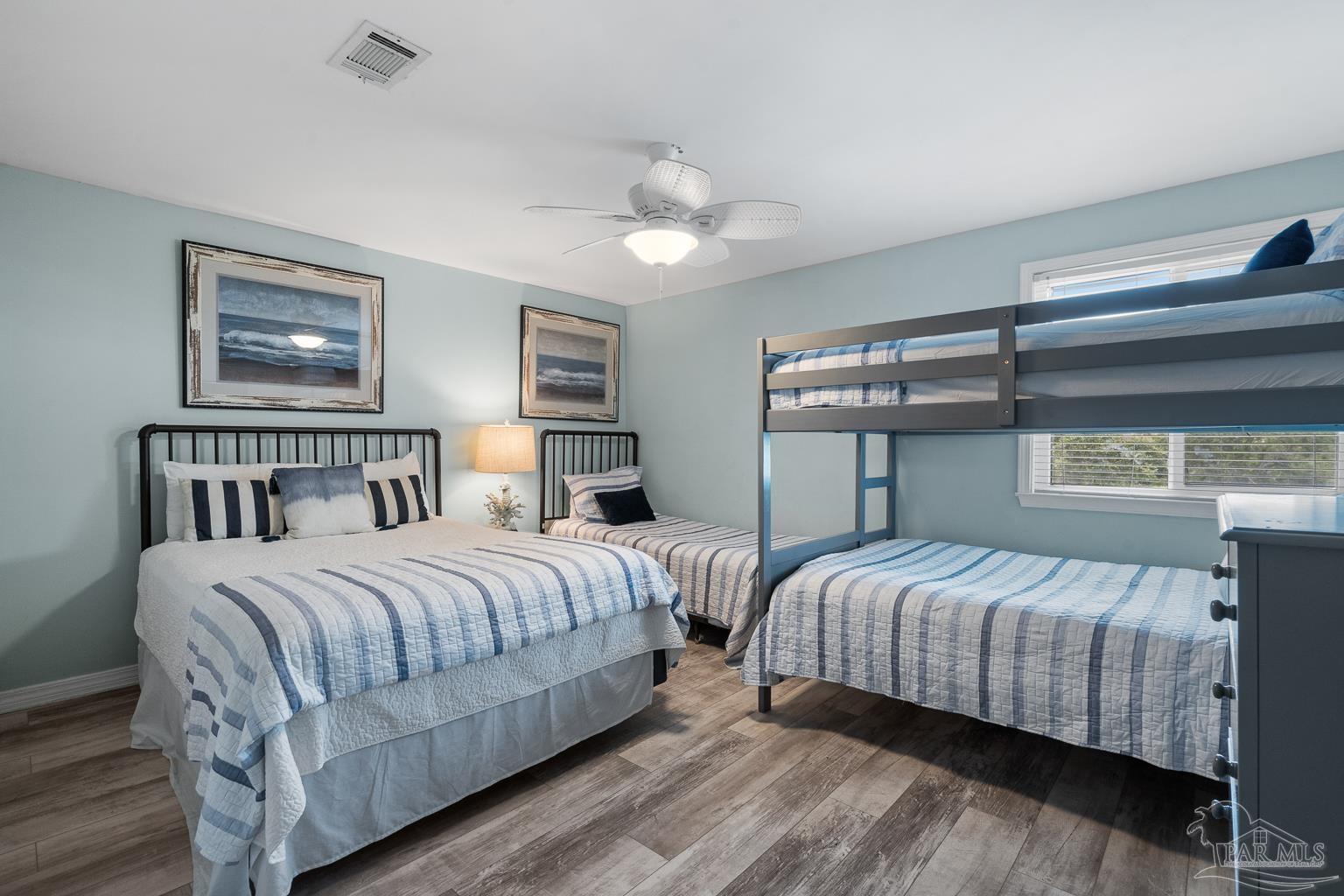 16470 Perdido Key Drive, Unit A 24 Perdido Key, FL 32507 - Photo 30 of 60 a bedroom with a bed and a night stand